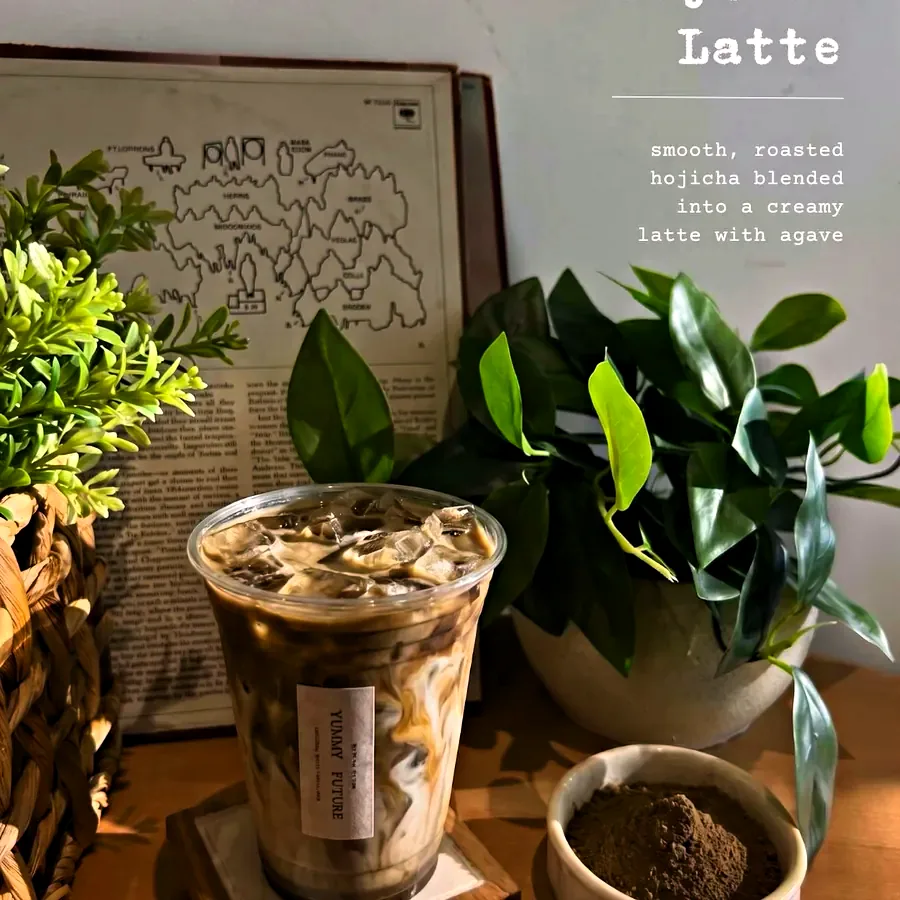 Instagram post: Iced Hojicha Latte in front of an old map print, hojicha powder in a dish