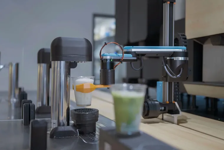 Side view of an early-generation Yummy Future robotic unit, the machine that ran the first store
